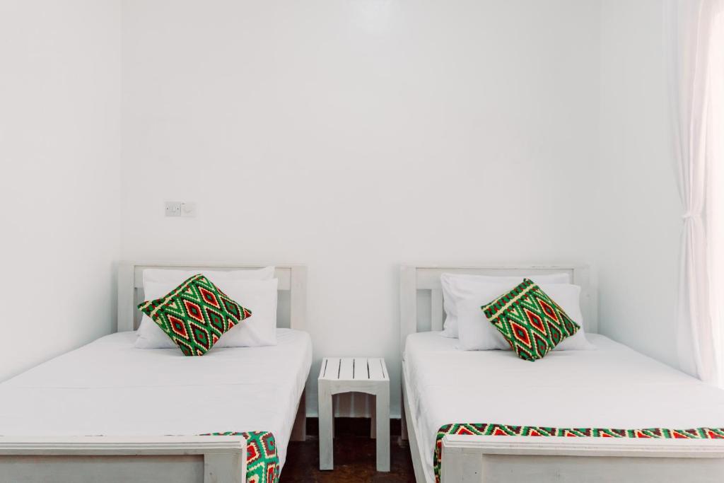 Postel nebo postele na pokoji v ubytování Avana Resort Watamu