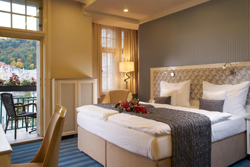 Postel nebo postele na pokoji v ubytování EA Hotel Atlantic Palace