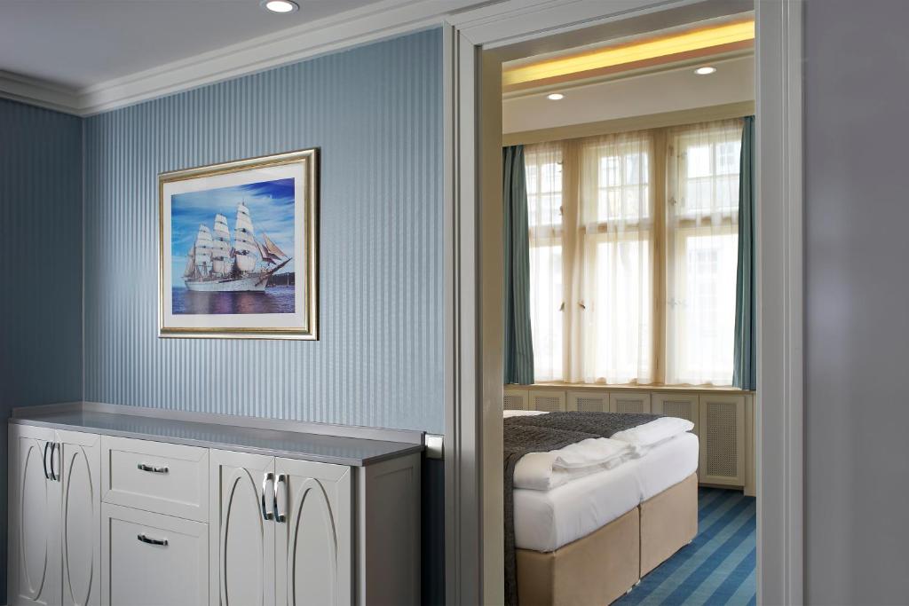 Postel nebo postele na pokoji v ubytování EA Hotel Atlantic Palace