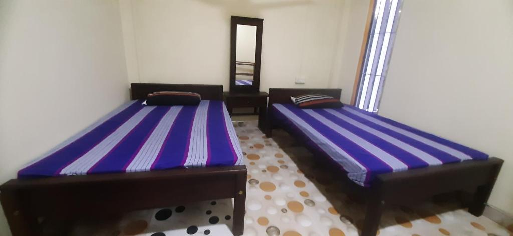 Voodi või voodid majutusasutuse Lucy Resort toas