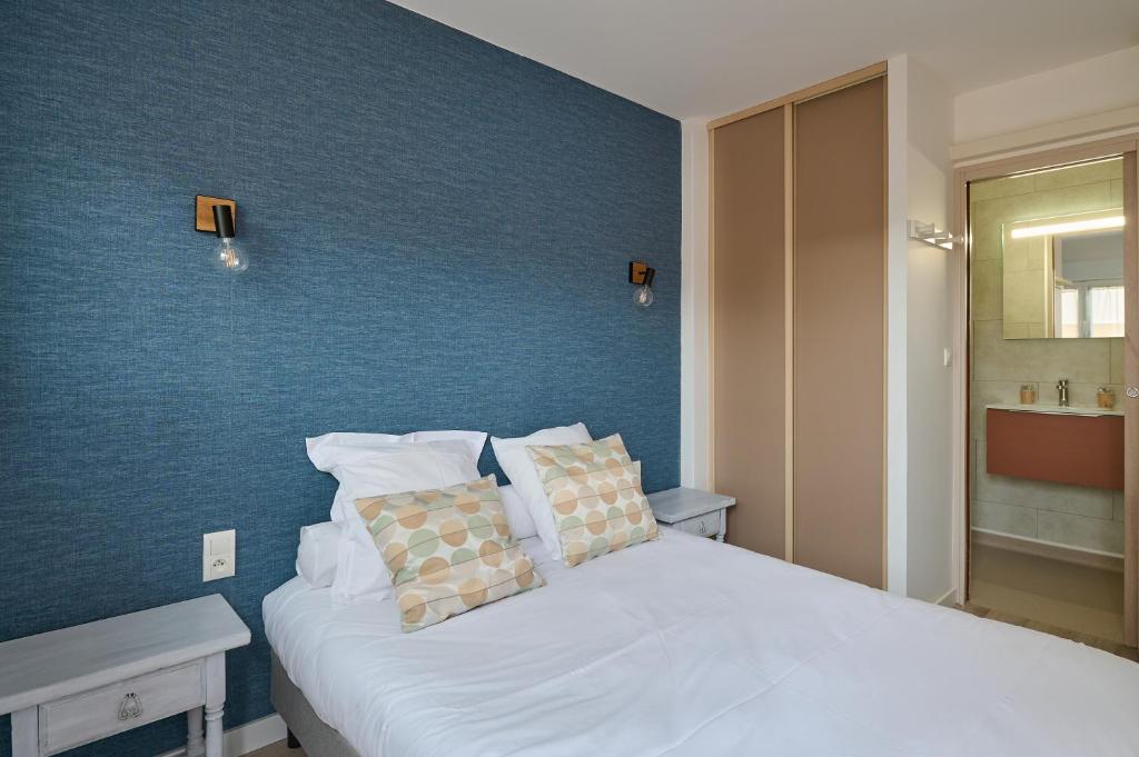 Postel nebo postele na pokoji v ubytování Hôtel Les Mimosas