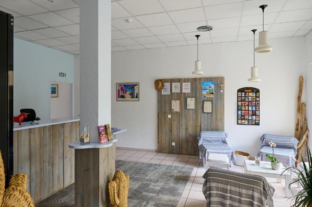 Posezení v ubytování Hôtel Les Mimosas