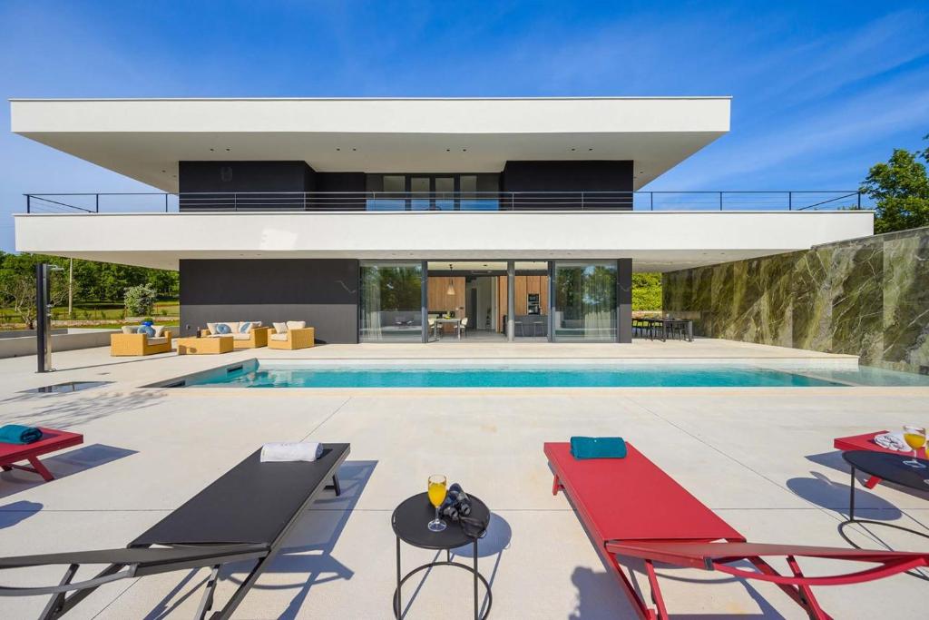 an image of a house with a swimming pool at Villa She Luxury in Boškari