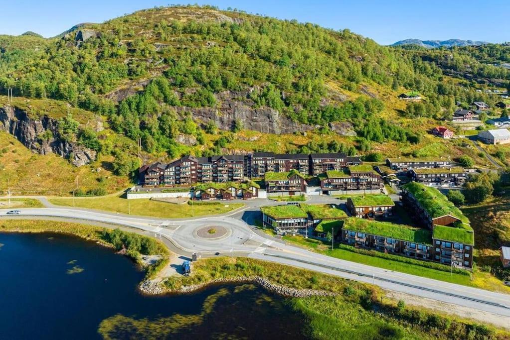 an aerial view of a town with a mountain at Cozy Apartment near alpine and trails in Sirdal in Sinnes