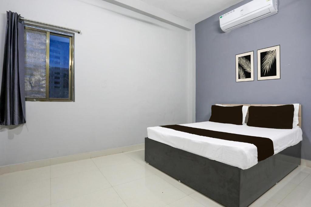 Postel nebo postele na pokoji v ubytování OYO Hotel Classic