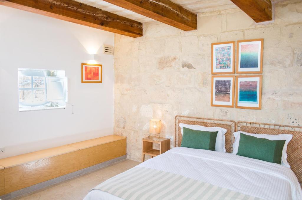 a bedroom with a bed in a room at San Anton Suites in Attard