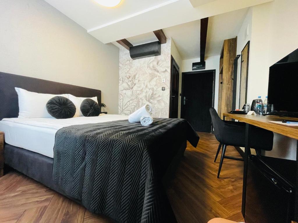 Posteľ alebo postele v izbe v ubytovaní Hotel Millennium