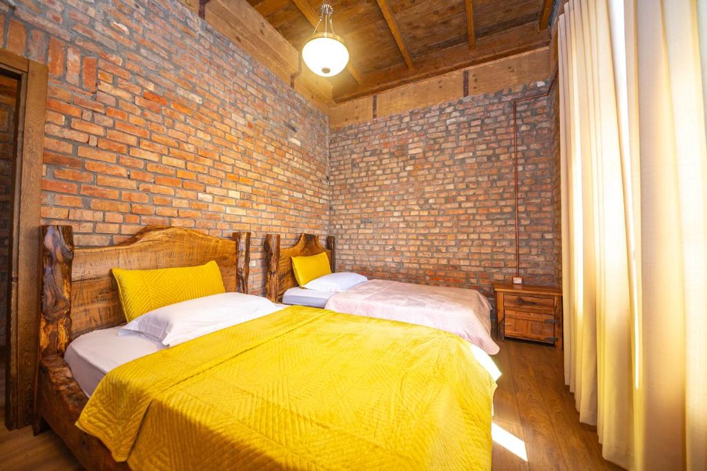 Postel nebo postele na pokoji v ubytování Hani i Taulant Shahinit
