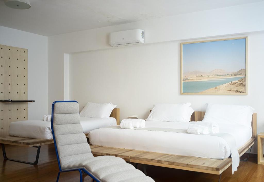 Llit o llits en una habitació de Imago Plus Hotel