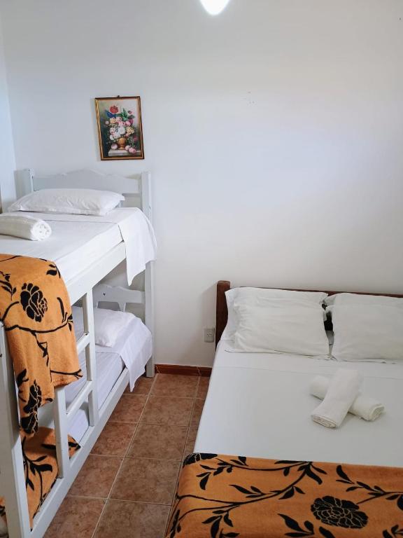 Postel nebo postele na pokoji v ubytování Pousada Canto de Guarajuba