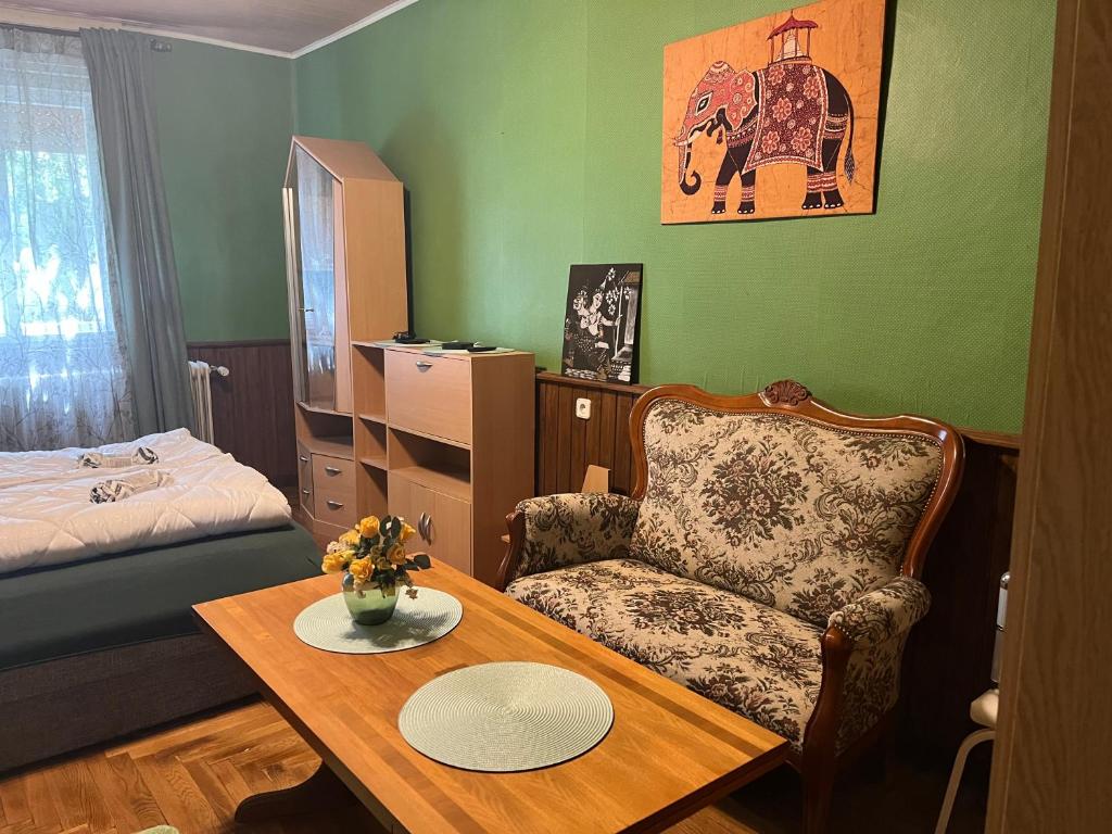 Postel nebo postele na pokoji v ubytování Golden Rose Apartman