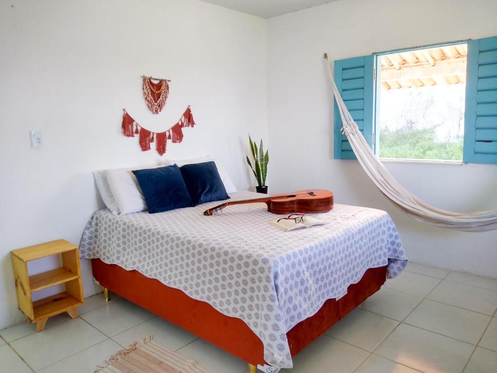 Säng eller sängar i ett rum på Casinha Estrela do Mar o Oceano aos seus Pés