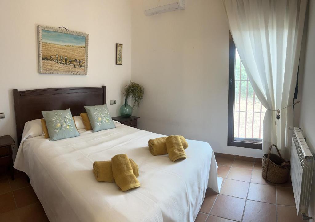 Ένα ή περισσότερα κρεβάτια σε δωμάτιο στο Casa Rural la Morera