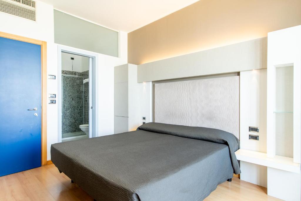 Postel nebo postele na pokoji v ubytování Hotel Baltic Riccione-Fronte Mare