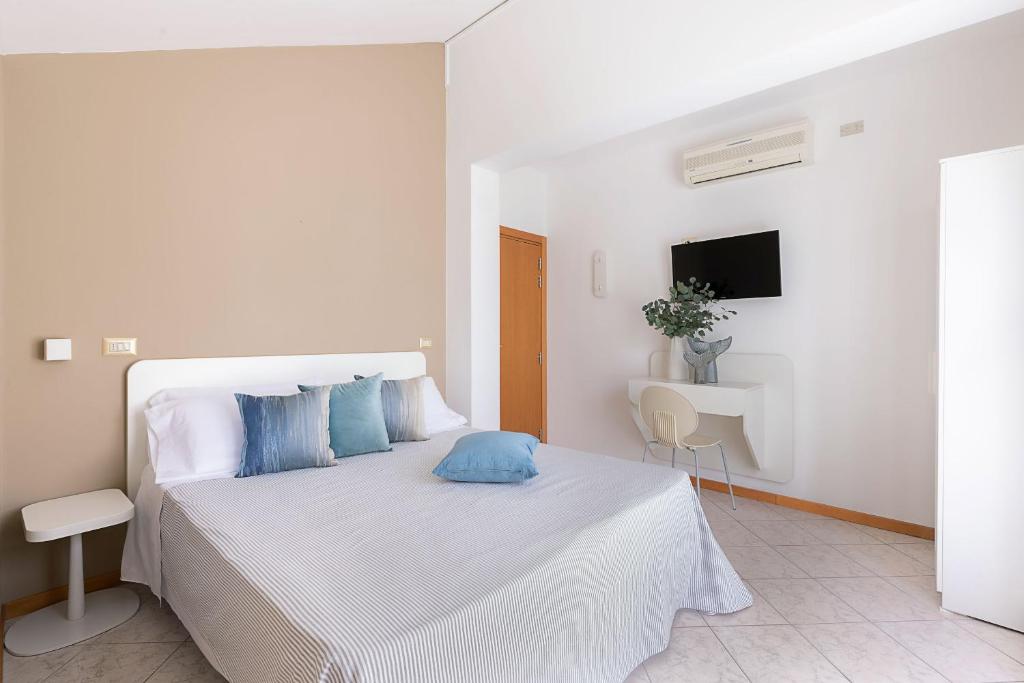 Postel nebo postele na pokoji v ubytování Hotel Adriatica con Piscina