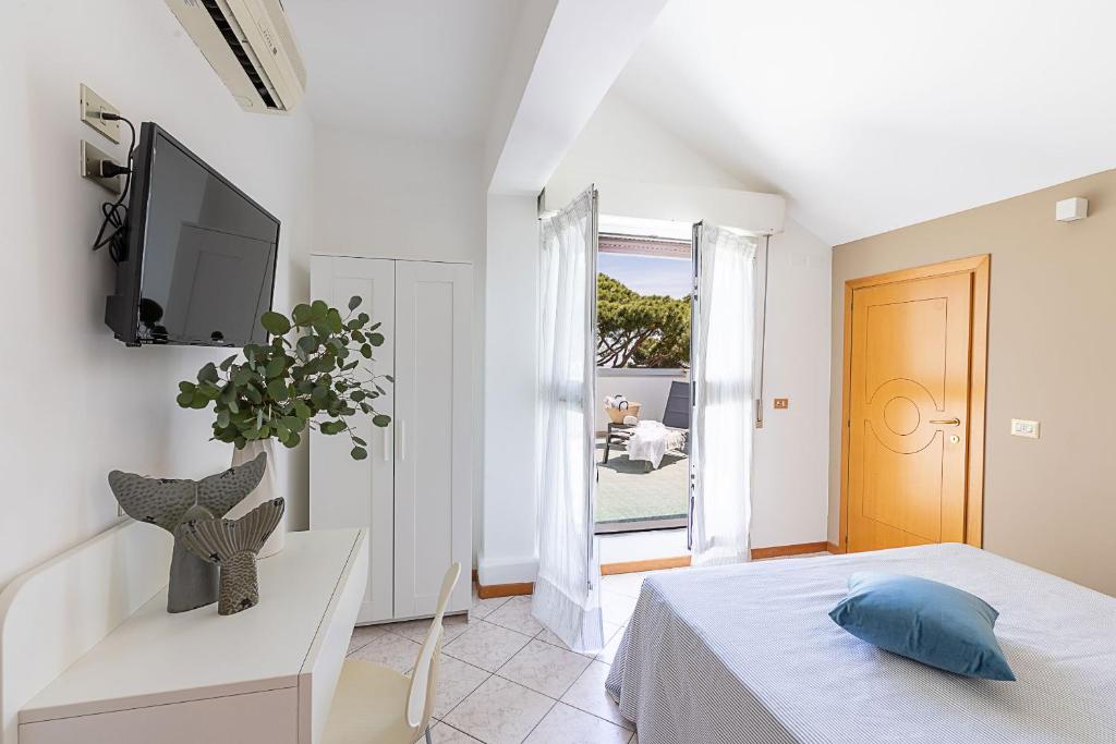 Postel nebo postele na pokoji v ubytování Hotel Adriatica con Piscina