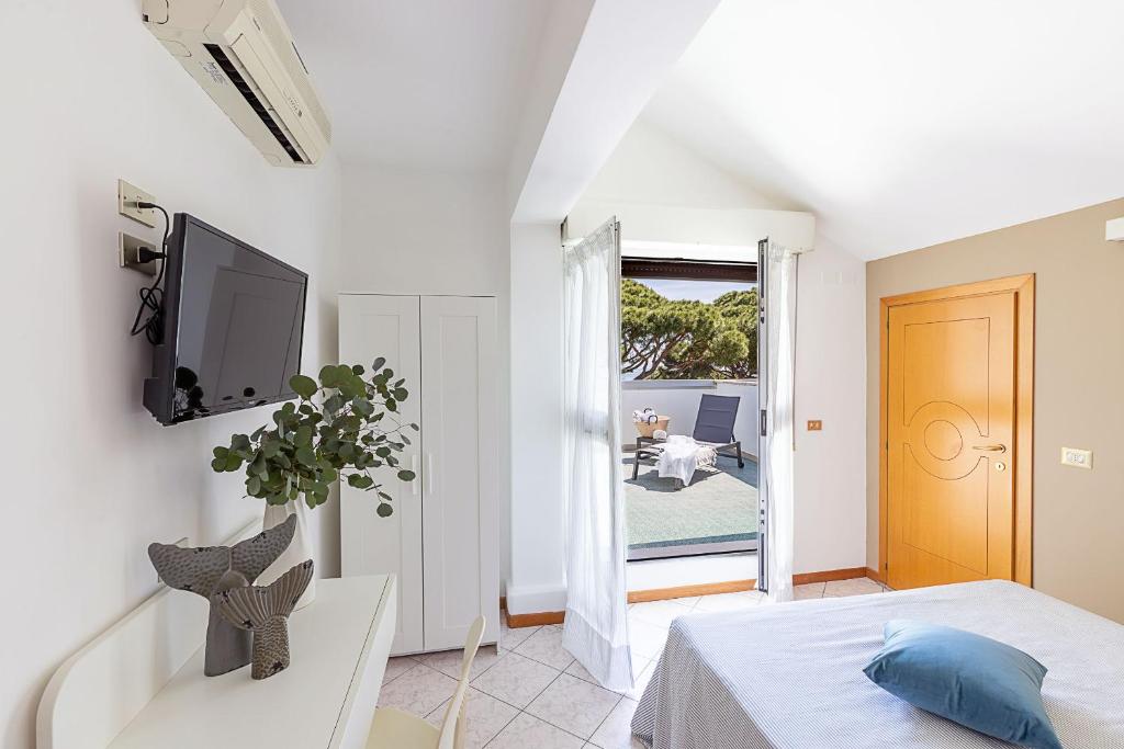 TV a/nebo společenská místnost v ubytování Hotel Adriatica con Piscina