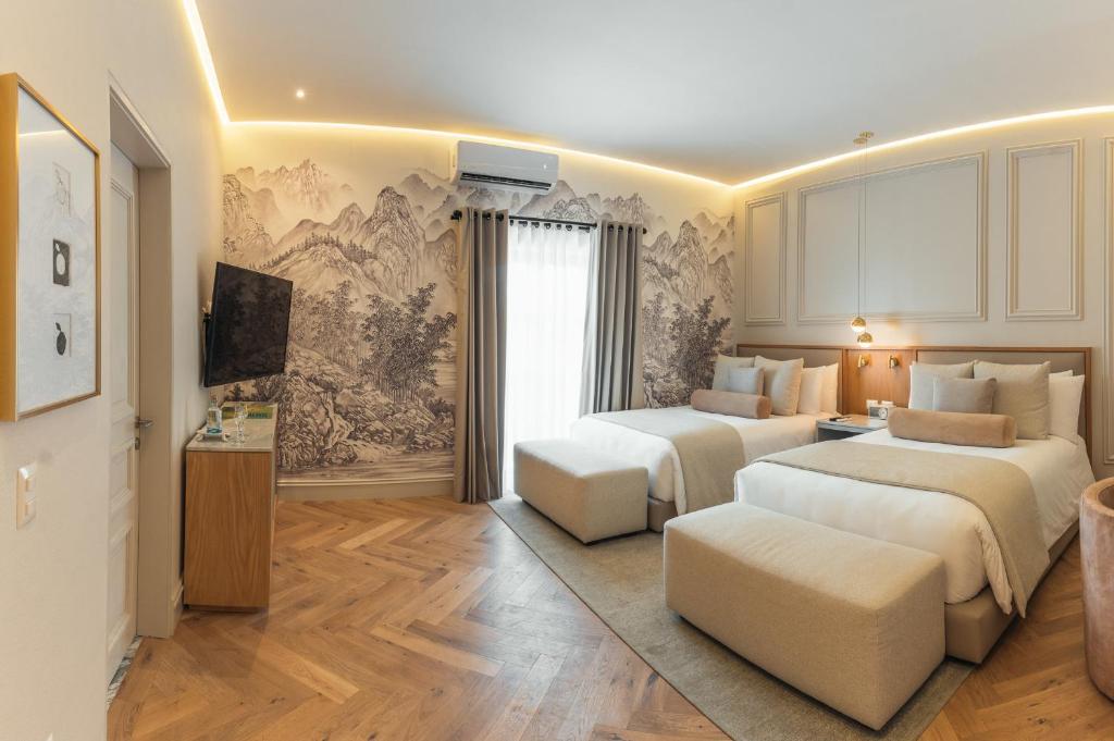 Postel nebo postele na pokoji v ubytování Hotel Maria Camille