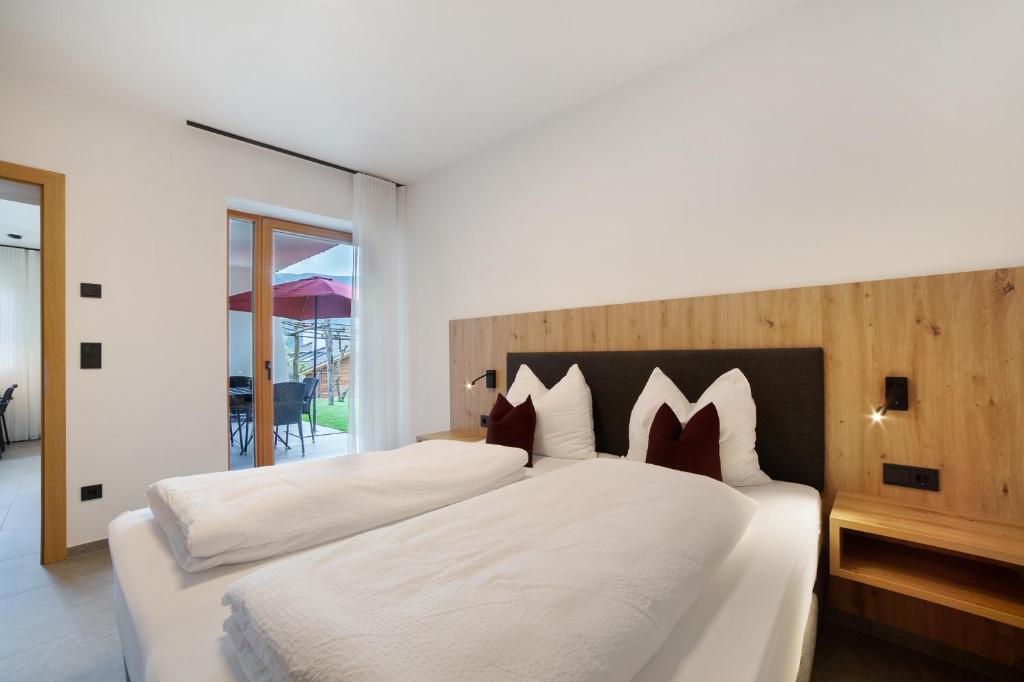 Postel nebo postele na pokoji v ubytování Haus Nummer 9
