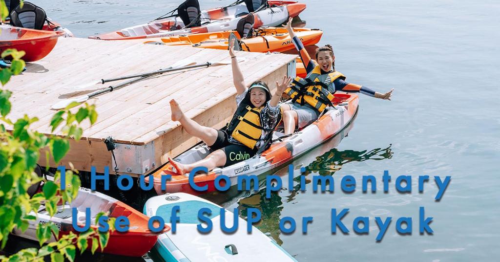 a group of people in a boat on the water at Living Stone Golf Resort in Collingwood