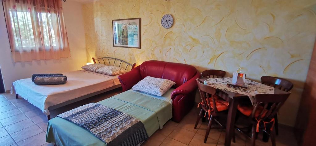 Postel nebo postele na pokoji v ubytování Studio Apartment Lela Ližnjan