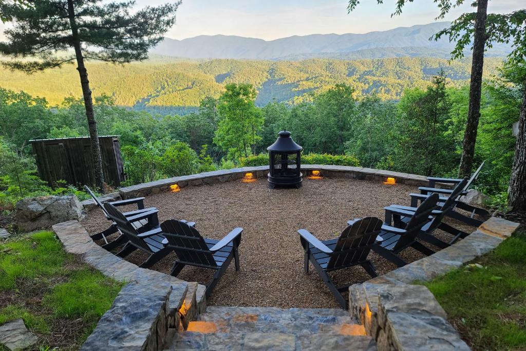 a group of chairs sitting around a fire pit with a view at Tallassee Family Home with Stunning Smoky Mtn Views in Tallassee