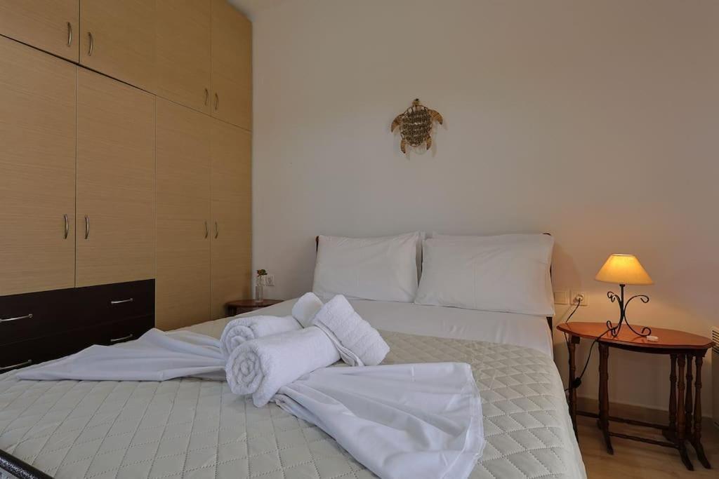 Postel nebo postele na pokoji v ubytování Zeusplace Leptokarya Seaside Apartment