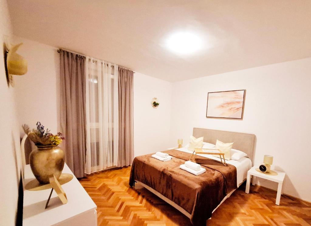 Posteľ alebo postele v izbe v ubytovaní Apartman Golden Star