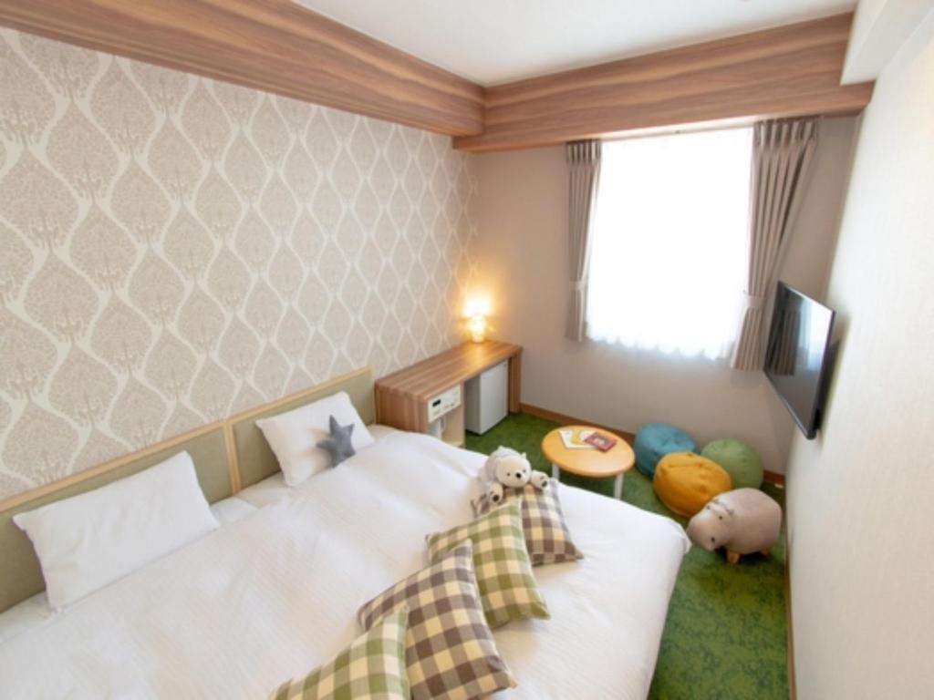 Кровать или кровати в номере Business Inn Norte Nakajima Park - Vacation STAY 08762v