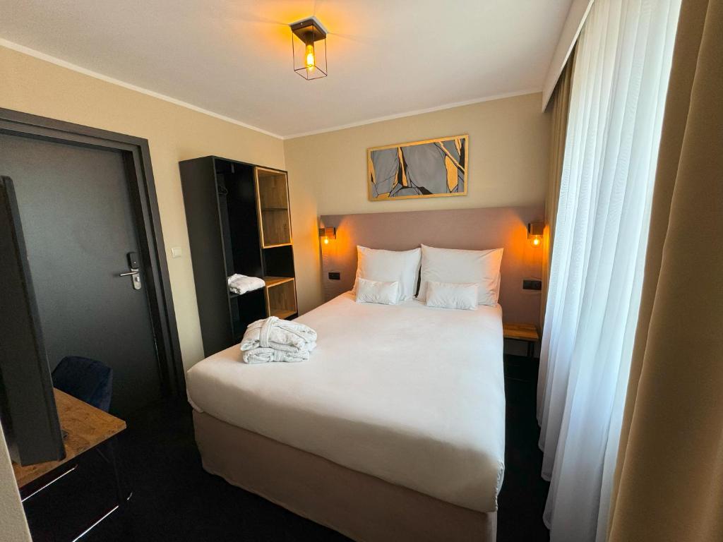 Postel nebo postele na pokoji v ubytování Amber Blue Wellness & SPA