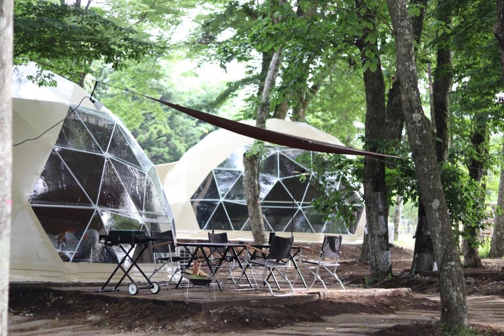 a group of tents with chairs in a park at The Day Post General Glamping Village Yamanakako - Vacation STAY 02720v in Yamanakako
