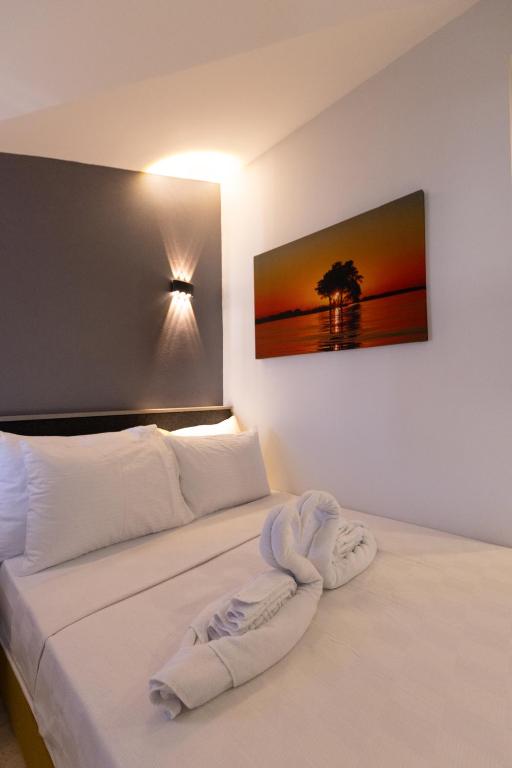 Postel nebo postele na pokoji v ubytování Three Points Hotel