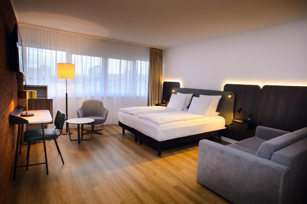 Postel nebo postele na pokoji v ubytování Tulip Inn Ludwigshafen City