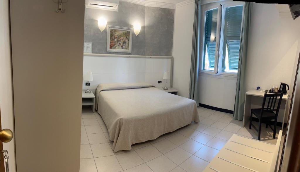 Postel nebo postele na pokoji v ubytování Hotel Marina