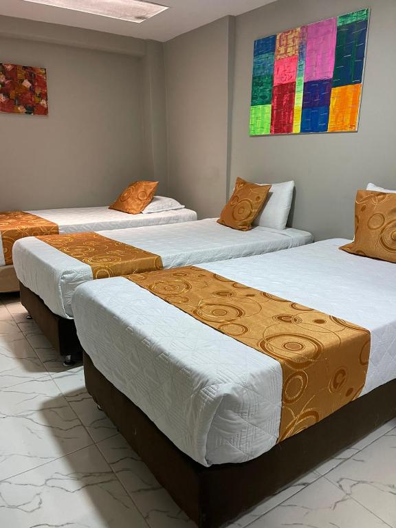 Postel nebo postele na pokoji v ubytování HOTEL LUXEM