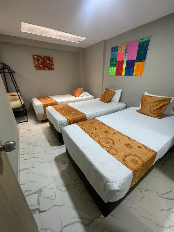 Postel nebo postele na pokoji v ubytování HOTEL LUXEM
