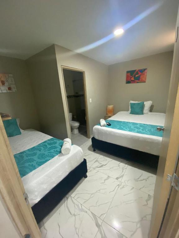 Postel nebo postele na pokoji v ubytování HOTEL LUXEM