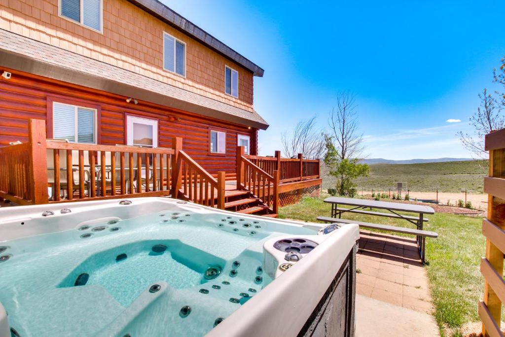 a hot tub in front of a house at Garden City Cabin about 6 Mi to Bear Lake State Park! in Garden City