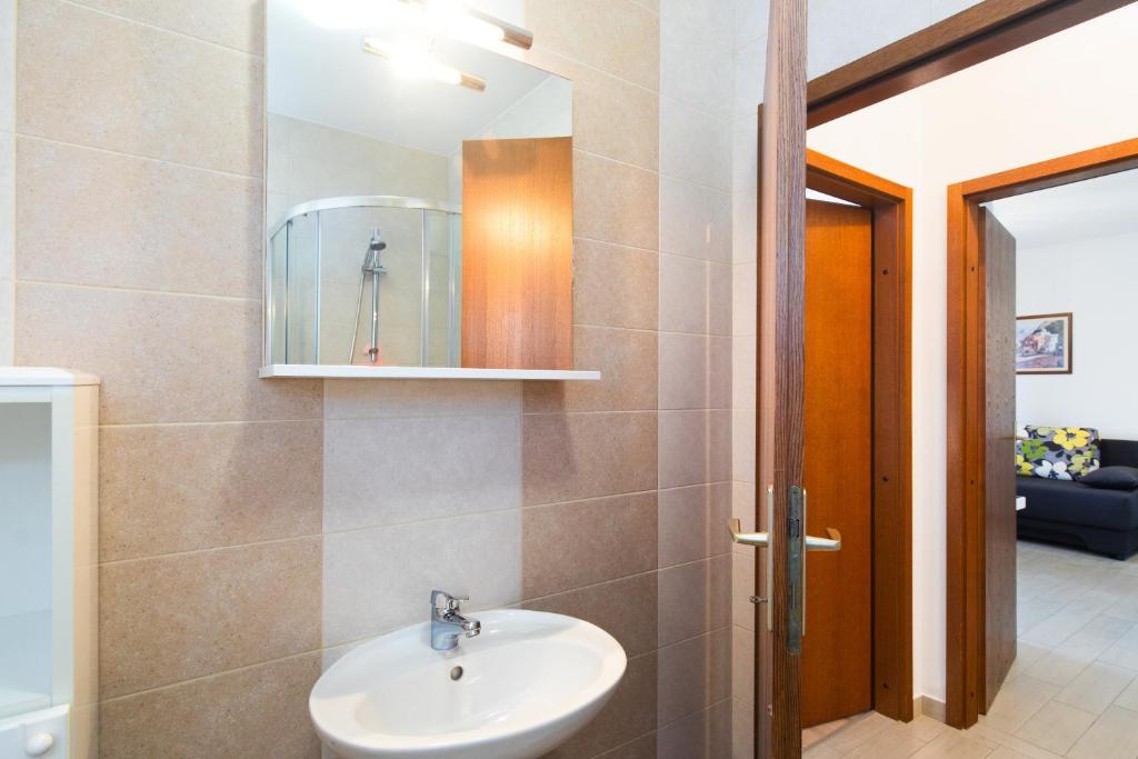 Kúpeľňa v ubytovaní Apartmani Pina