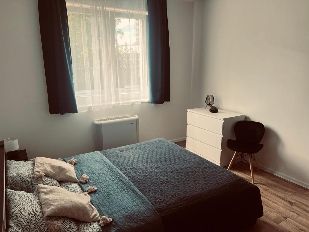 Posteľ alebo postele v izbe v ubytovaní Elit Medencés Apartman Hajdúszoboszló