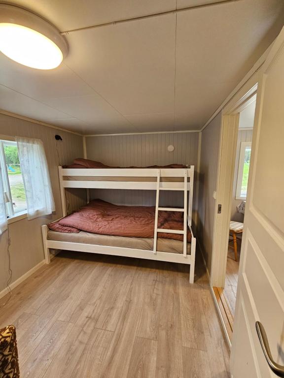 Postel nebo postele na pokoji v ubytování Tørfoss Gård, Hytte utleie, Campingvogn og bobil plasser
