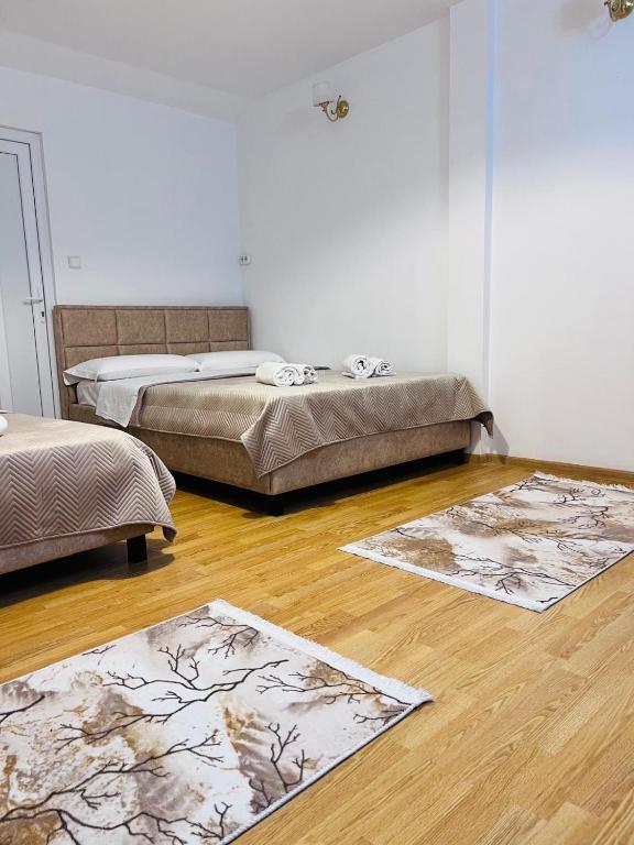 Postel nebo postele na pokoji v ubytování IMPERIUM DK VILLA