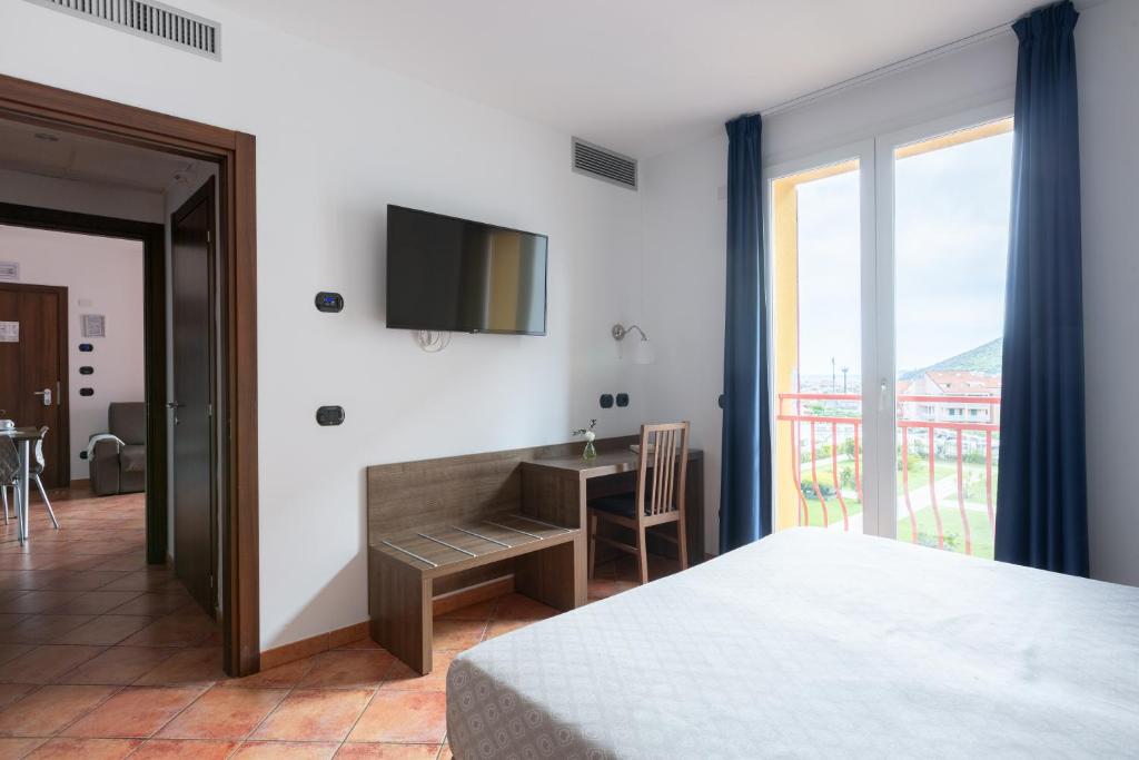 Postel nebo postele na pokoji v ubytování Ai Pozzi Village Resort & SPA