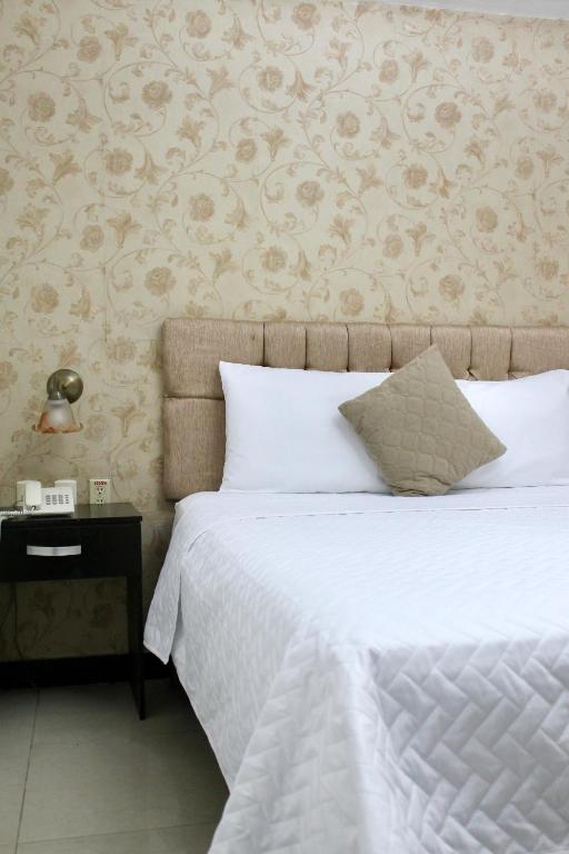 Postel nebo postele na pokoji v ubytování Hotel Presidente Internacional