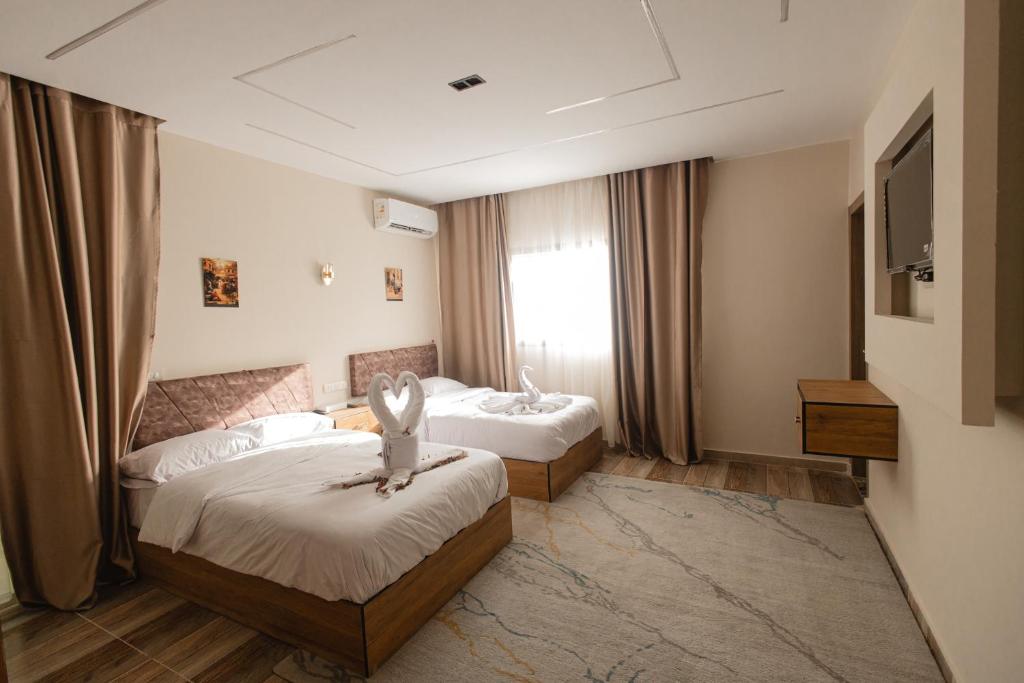 Postel nebo postele na pokoji v ubytování The View Pyramids Hotel