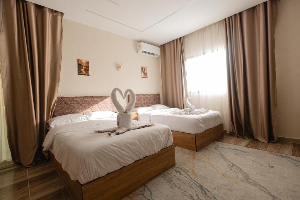 Postel nebo postele na pokoji v ubytování The View Pyramids Hotel