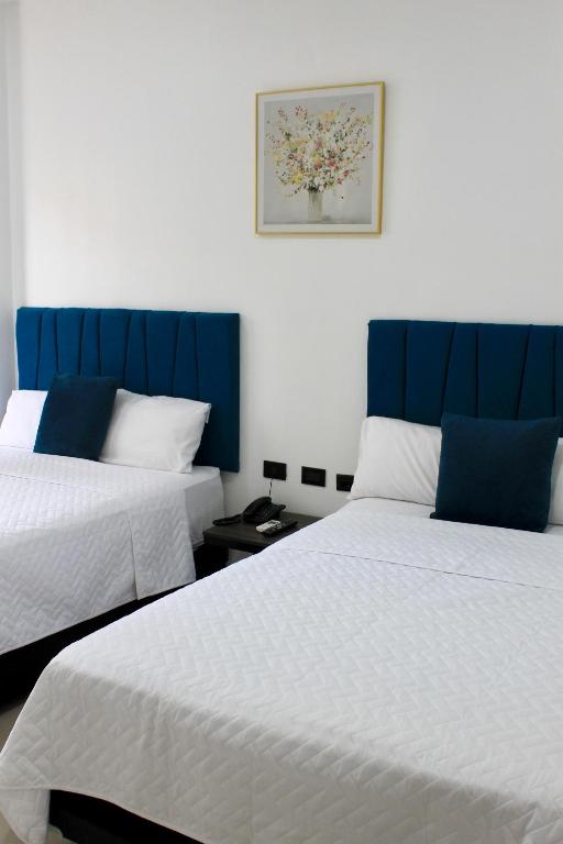 Postel nebo postele na pokoji v ubytování Hotel Presidente Internacional