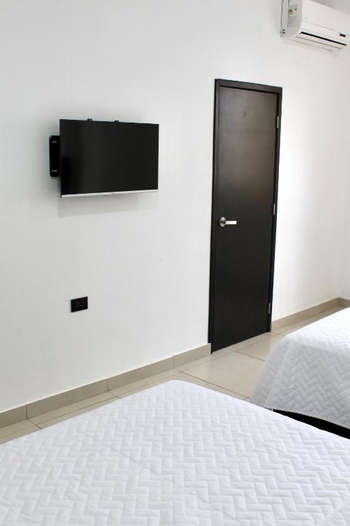 TV a/nebo společenská místnost v ubytování Hotel Presidente Internacional