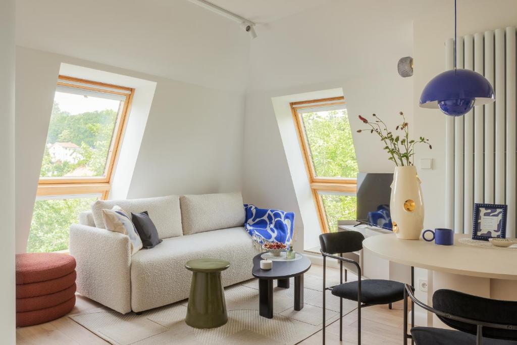 a living room with a couch and a table at Sopot M17 - by JWPM in Sopot