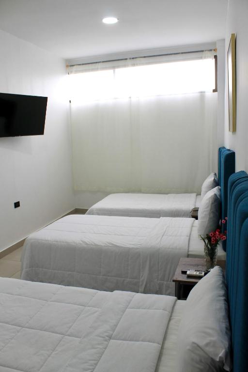 Postel nebo postele na pokoji v ubytování Hotel Presidente Internacional